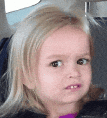 Reaction GIF: a kid giving a confused side-eye
